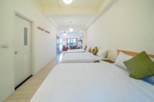 Postel nebo postele na pokoji v ubytování Hui Yun B&B