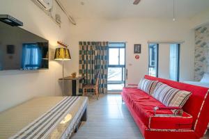TV a/nebo společenská místnost v ubytování Hui Yun B&B