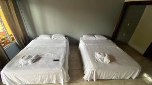 Postel nebo postele na pokoji v ubytování Hotel Puerto San Luis