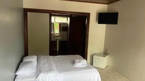 Postel nebo postele na pokoji v ubytování Hotel Puerto San Luis