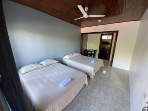 Postel nebo postele na pokoji v ubytování Hotel Puerto San Luis