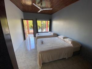 Postel nebo postele na pokoji v ubytování Hotel Puerto San Luis