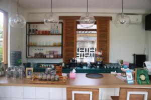 a kitchen with a counter with a counter top at Liberta Malioboro in Yogyakarta