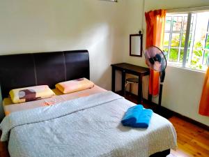 Ένα ή περισσότερα κρεβάτια σε δωμάτιο στο Soboroong Farmer's Cottage