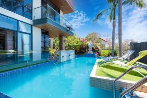 a swimming pool in the backyard of a house at Lavie House 6 12-6 Trần Phú in Vung Tau