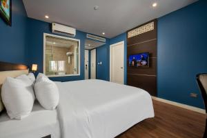 Ένα ή περισσότερα κρεβάτια σε δωμάτιο στο Hanoi 20 Hotel & Apartment