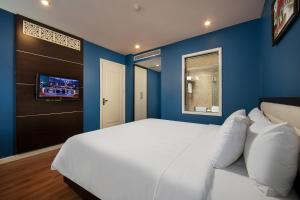 Ένα ή περισσότερα κρεβάτια σε δωμάτιο στο Hanoi 20 Hotel & Apartment