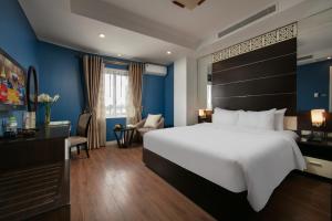 Ένα ή περισσότερα κρεβάτια σε δωμάτιο στο Hanoi 20 Hotel & Apartment