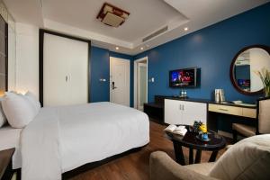 Ένα ή περισσότερα κρεβάτια σε δωμάτιο στο Hanoi 20 Hotel & Apartment