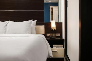 Ένα ή περισσότερα κρεβάτια σε δωμάτιο στο Hanoi 20 Hotel & Apartment