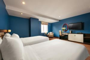 Ένα ή περισσότερα κρεβάτια σε δωμάτιο στο Hanoi 20 Hotel & Apartment