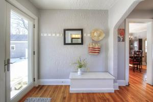 a living room with a vase of flowers on a table at Belltown Retreat in Stamford +34 photos