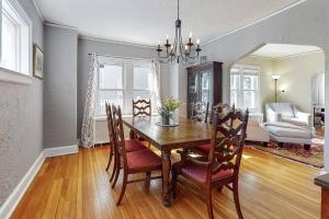 a dining room with a wooden table and chairs at Belltown Retreat in Stamford