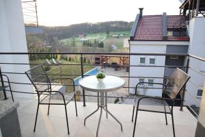 a balcony with a table and chairs and a view at Apartment Vesna Toplice Sveti Martin in Sveti Martin na Muri