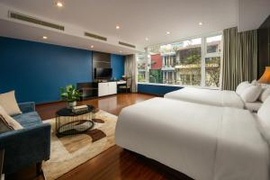 Ένα ή περισσότερα κρεβάτια σε δωμάτιο στο Hanoi 20 Hotel & Apartment