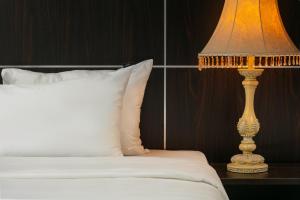 Ένα ή περισσότερα κρεβάτια σε δωμάτιο στο Hanoi 20 Hotel & Apartment