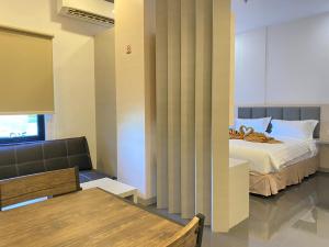 Postel nebo postele na pokoji v ubytování BATAM 1 HOTEL