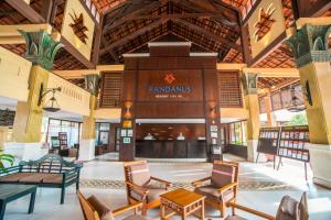 a lobby of a resort with a fireplace at Pandanus Resort in Mui Ne