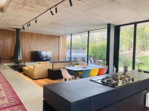 a living room with a table and a couch at Brickyard Retreat at Mutianyu Great Wall Adjoin to Mutianyu Great Wall - Room with the View of Great Wall - Chinese massage experience - Vehicle Shuttle Service - International Catering - SPA& Nail Beauty Facilities in Huairou