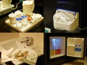 bagno con lavandino e frigorifero aperto di E Red Hotel Alma Cosmo a Bukit Mertajam