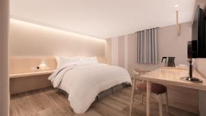 Katil atau katil-katil dalam bilik di Ta Lee Hotel