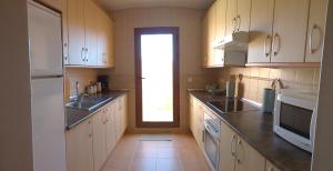 A kitchen or kitchenette at Attic apartment in Vera Beach with wifi and air-conditioning