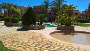 A garden outside Attic apartment in Vera Beach with wifi and air-conditioning