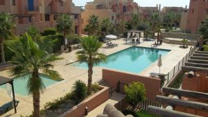 The swimming pool at or close to Attic apartment in Vera Beach with wifi and air-conditioning