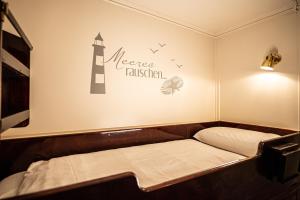 Postel nebo postele na pokoji v ubytování Das Feuerschiff