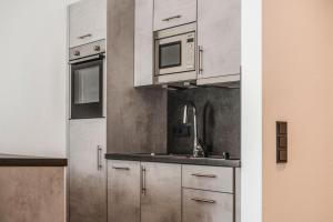 Kuchyň nebo kuchyňský kout v ubytování Kopeindlgut Apartments + 37 fotografií