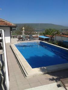 a swimming pool on a roof of a house at Elbarr Rogachevo in Rogachevo
