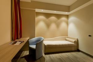 Tempat tidur dalam kamar di Hotel Norden Palace