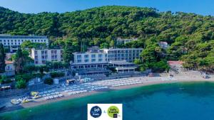 an aerial view of a beach with buildings and the water at Hotel Vis in Dubrovnik