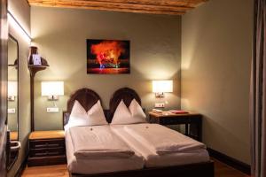Voodi või voodid majutusasutuse Altstadt Hotel Stadtkrug toas