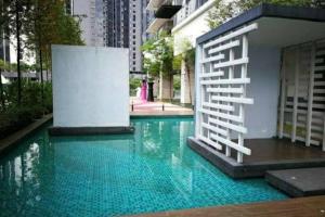 a swimming pool with a stair in the middle of a building at Luxury Apartment The Elements Ampang in Kuala Lumpur