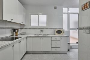 Kuchyň nebo kuchyňský kout v ubytování Apartamento Boliches