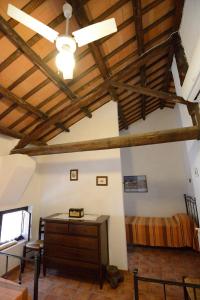a room with a bed and a wooden ceiling at Duca di Castelmonte in Trapani