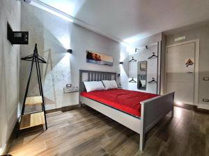 A bed or beds in a room at City Focus Apartments Napoli