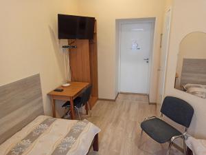 TV a/nebo společenská místnost v ubytování Central Hotel