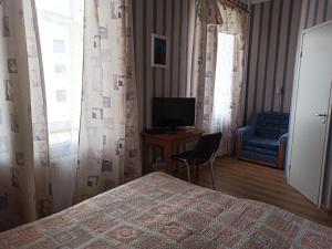TV a/nebo společenská místnost v ubytování Central Hotel