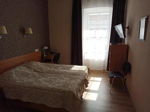 Postel nebo postele na pokoji v ubytování Central Hotel
