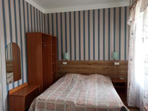 Postel nebo postele na pokoji v ubytování Central Hotel