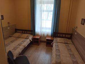 Postel nebo postele na pokoji v ubytování Central Hotel