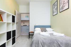 
A bed or beds in a room at Business Apartments Warsaw Mokotów by Renters
