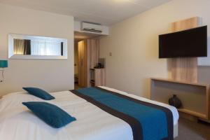 TV a/nebo společenská místnost v ubytování Best Western Hotel Baars