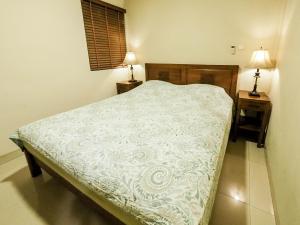 Postel nebo postele na pokoji v ubytování Rhiz Guest House Tebet