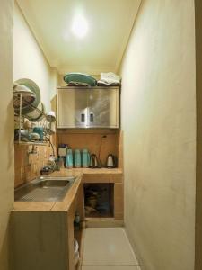 Kuchyň nebo kuchyňský kout v ubytování Rhiz Guest House Tebet