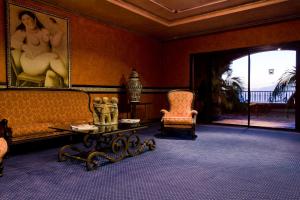 a living room with a couch and a table and a chair at Europe Villa Cortes GL in Playa de las Americas