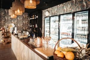 a bar with a basket of fruit on a counter at Hotell Östersund in Östersund