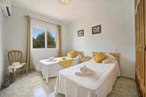 Łóżko lub łóżka w pokoju w obiekcie 3314 Villa Belinda
